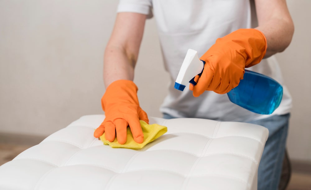 woman-with-rubber-gloves-cleaning-